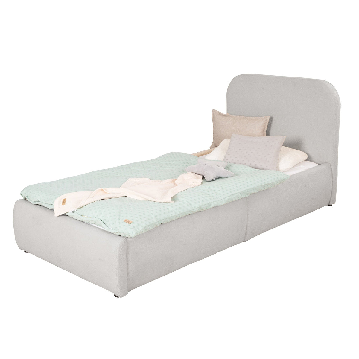 Light grey bouclé children's bed with fall protection and mint bed linen, cut-out image.