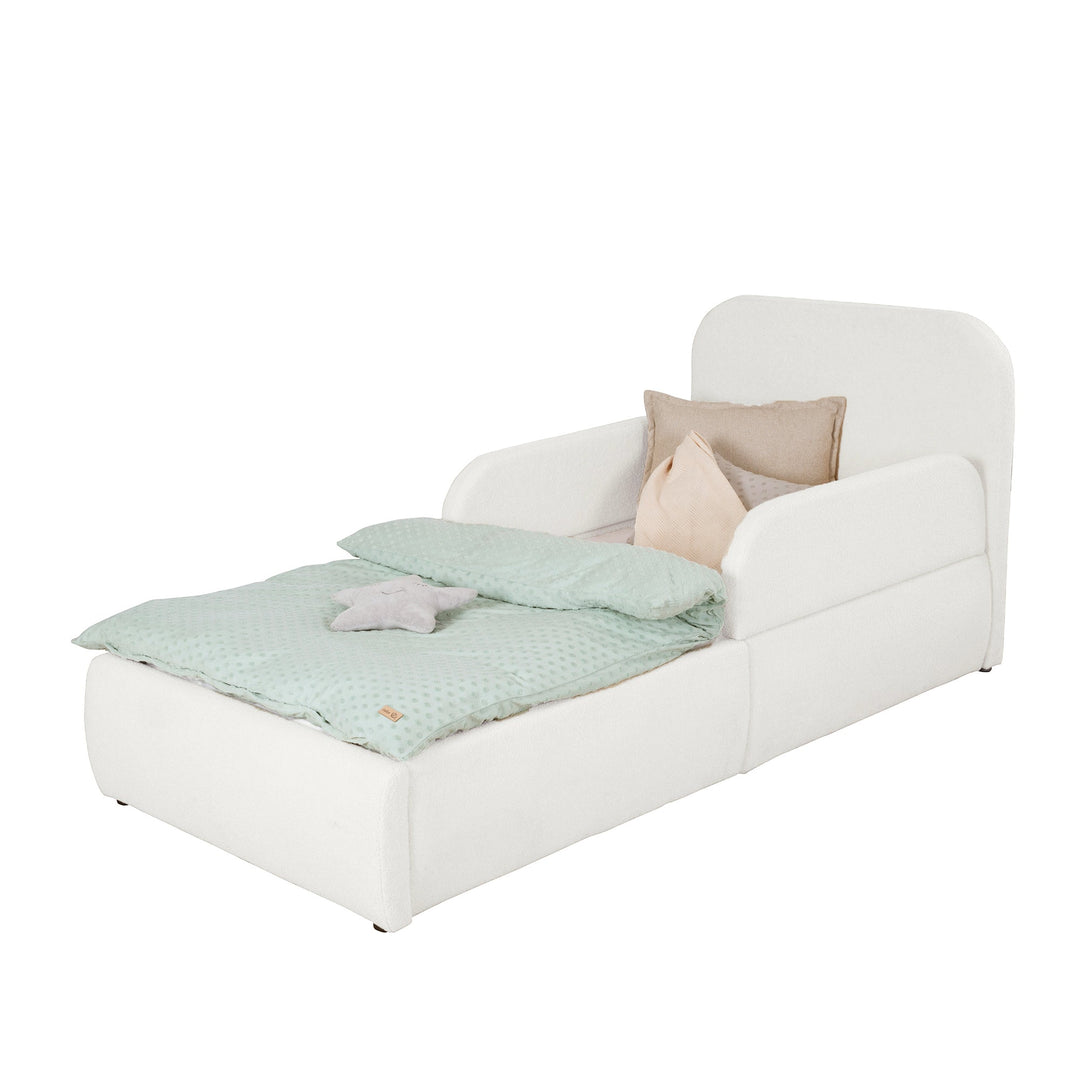 White bouclé children's bed with fall protection, headboard and mint bed linen, cut-out image.