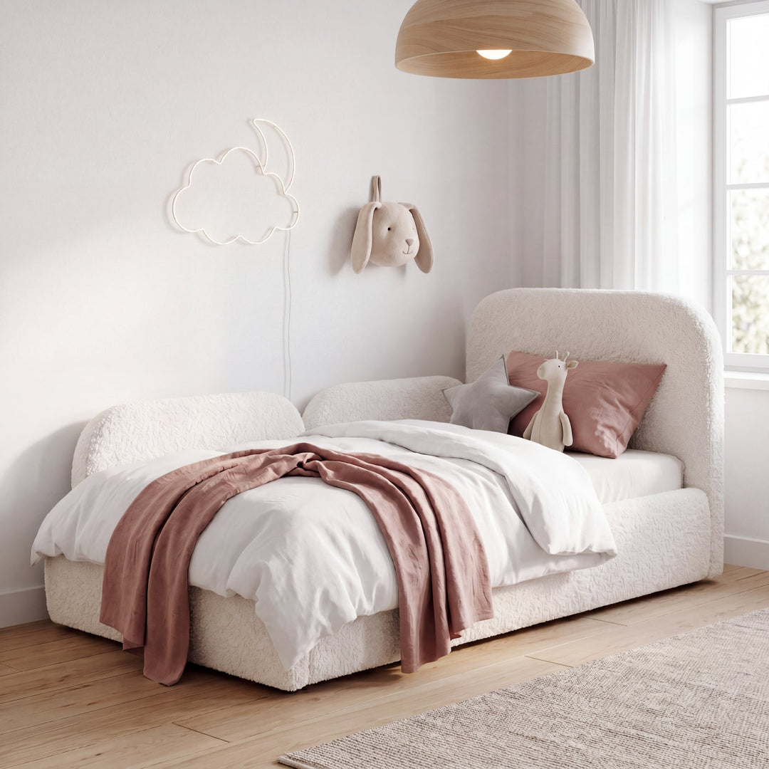 White bouclé children's bed with fall protection, cuddly toys and cloud-and-moon fairy lights. Fully AI-generated.