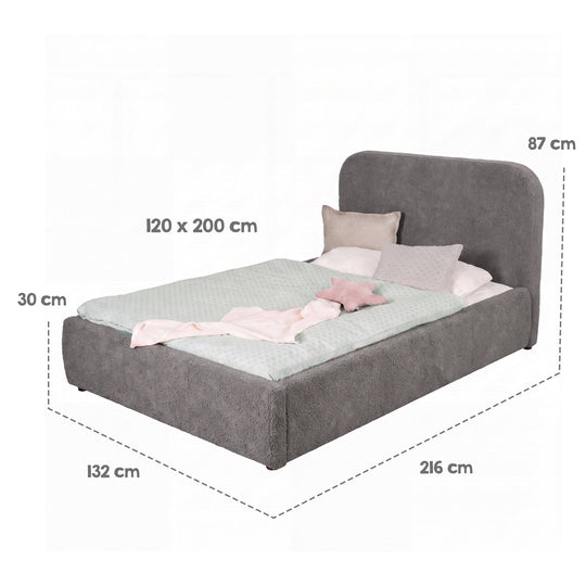 Grafica delle dimensioni del letto grigio con biancheria: superficie di riposo 120×200 cm, dimensioni totali 216×132×87 cm.