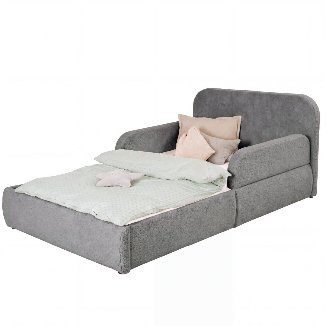 Anthracite roba Little Dream children's bed with headboard and side guards, made up with bed linen and pillows. Partially AI-generated.