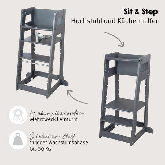Lifestyle-Bild: leerer Lernturm 'Sit & Step' in Anthrazit neben einem dunklen Holz-Esstisch mit gepolsterten Stühlen.